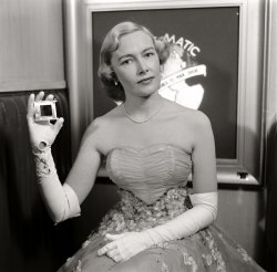 June 6, 1950. "Vis-O-Matic department store." A Vis-O-Matic spokesmodel, or perhaps even the queen of Vis-O-Matic, the Canadian catalog store whose slide-projection system of displaying merchandise was like a Buck Rogers premonition of online shopping. The Vis-O-Matic phenomenon seems to have been short-lived, with hardly any documentation online aside from these photos in the Life archive, and no word of its fate. Photo by Bernard Hoffman. View full size.